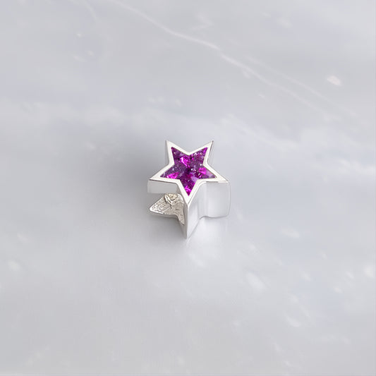 Charm con forma de Estrella y Fondo Brillante con Cenizas