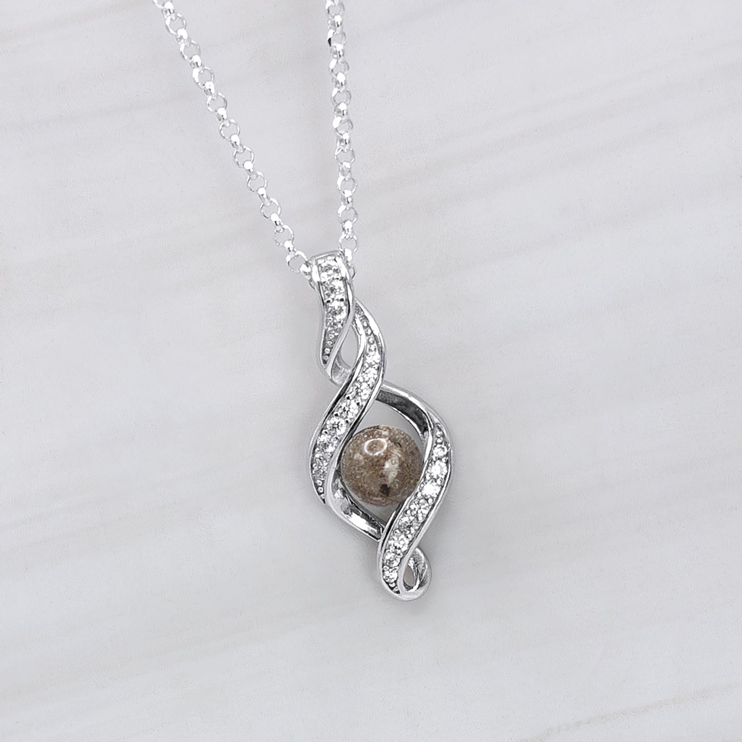 Colgante con Cenizas en Esfera en Lazo de Plata con Circonitas