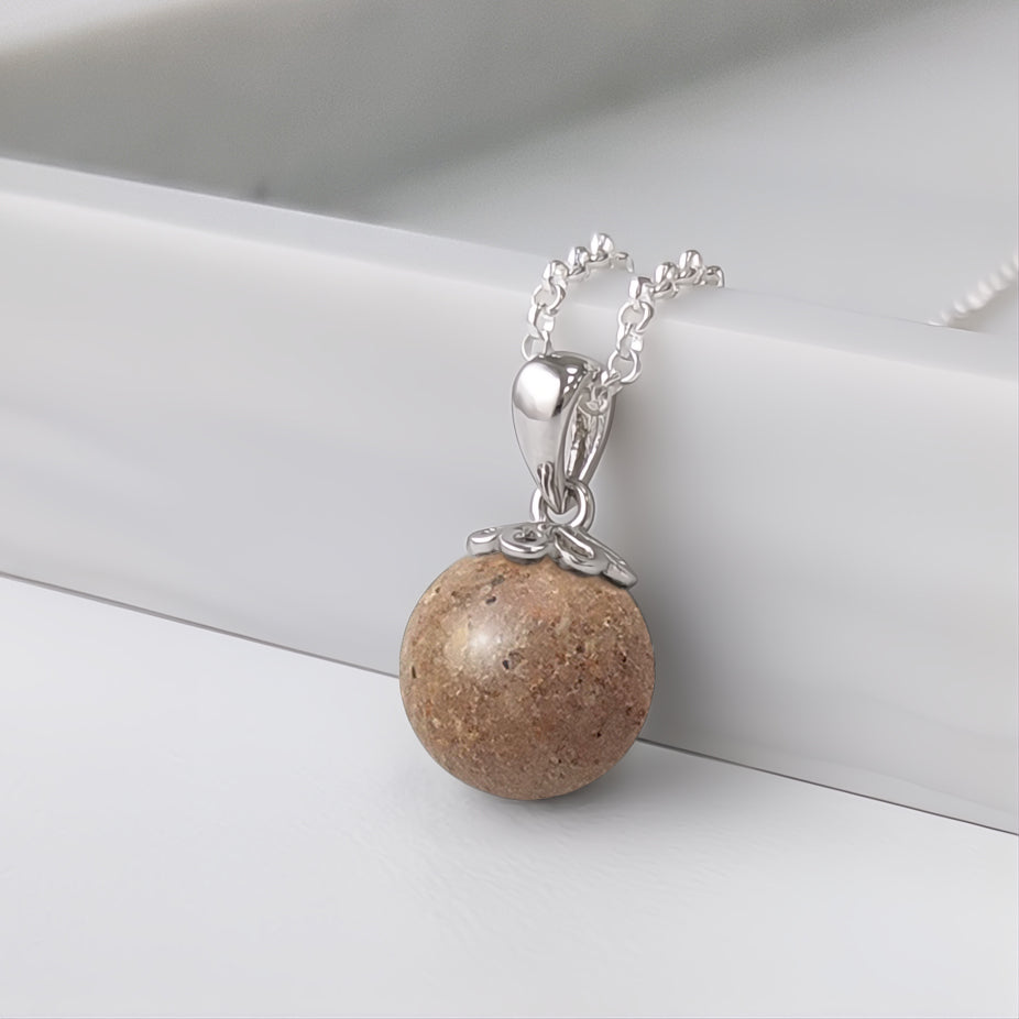 Colgante de plata · Perla con arena o tierra