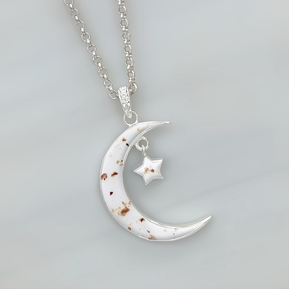 Colgante con cordón umbilical · Luna y estrella con cordón umbilical