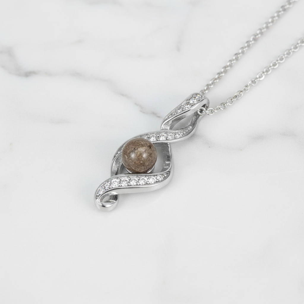 Colgante con Cenizas en Esfera sobre Bucle de Plata y Circonitas