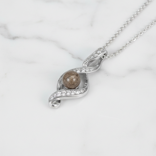 Colgante con Cenizas en Esfera sobre Bucle de Plata y Circonitas