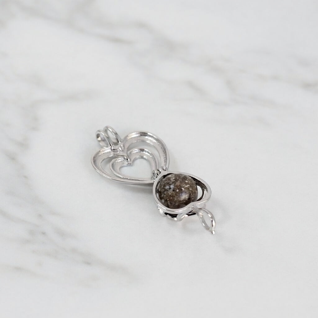 Colgante con Cenizas en Esfera dentro de Jaula Corazon de Plata de Ley