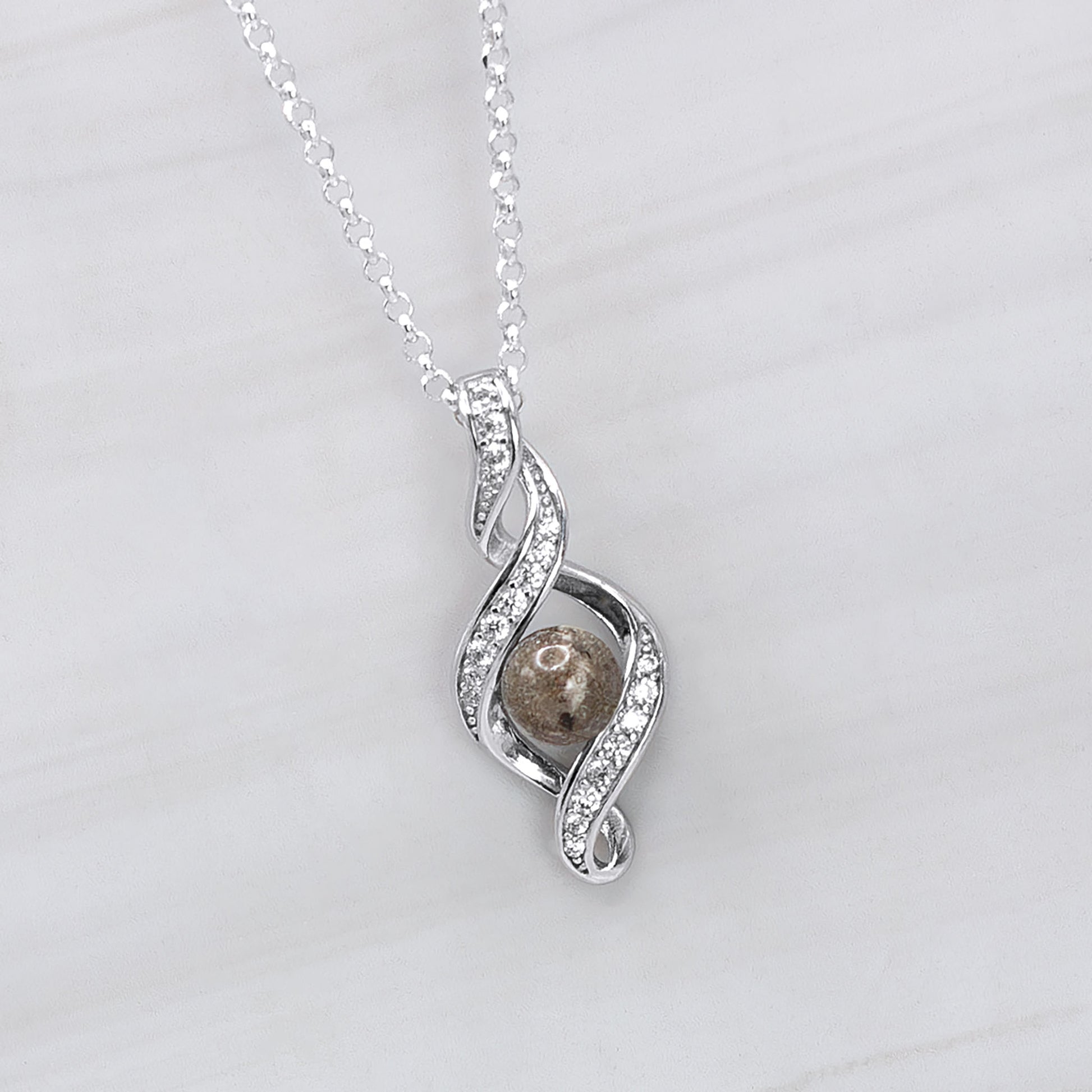 Colgante con Cenizas en Esfera en Lazo de Plata con Circonitas