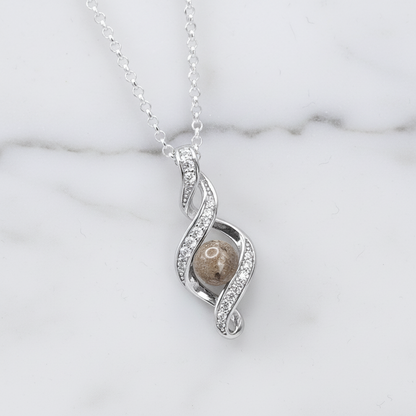 Colgante con Cenizas en Esfera sobre Bucle Infinito de Plata