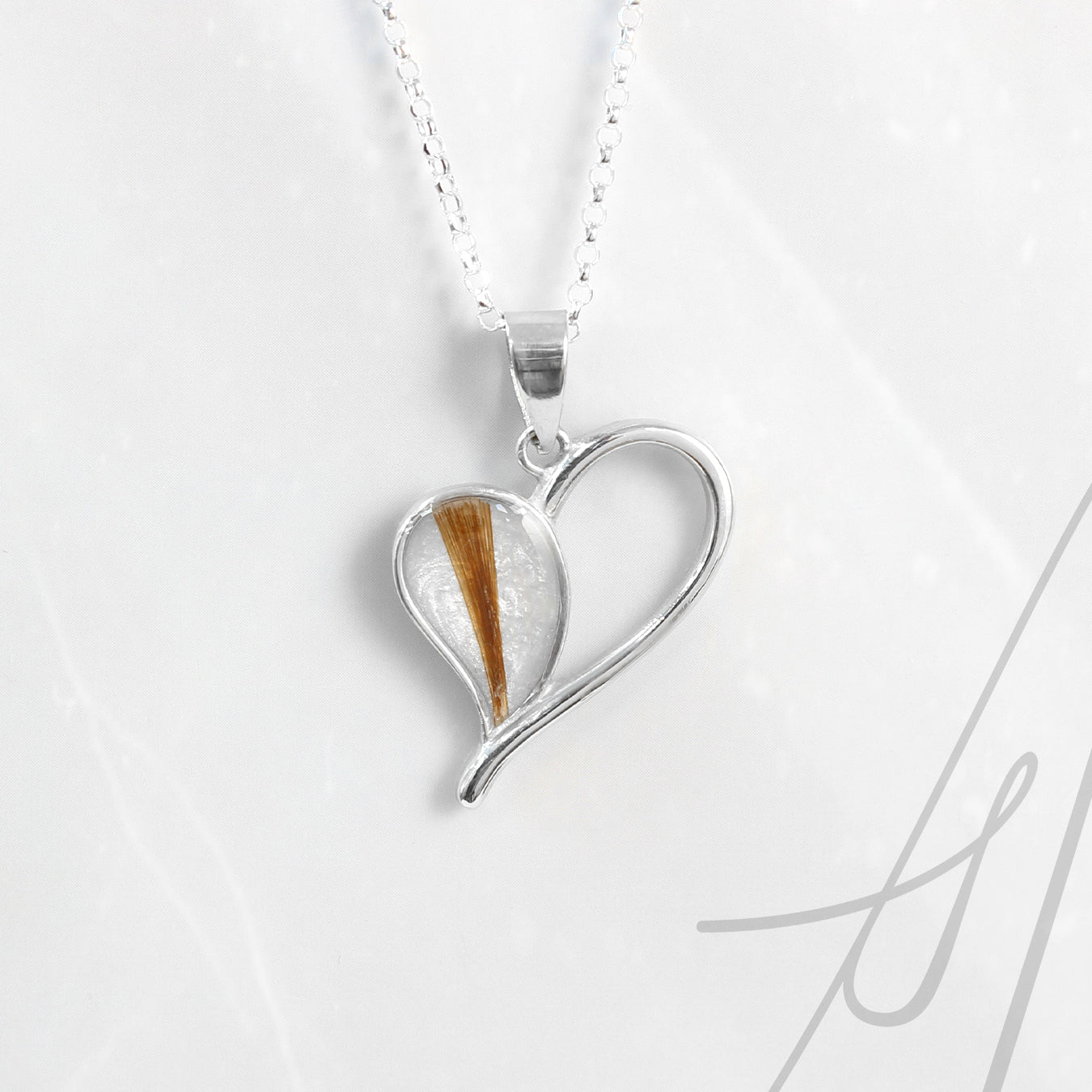 Colgante con Pelo en Corazon Latiendo de Plata