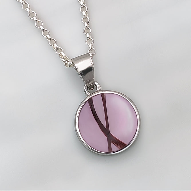 Colgante con pelo · Circulo de plata con pelo