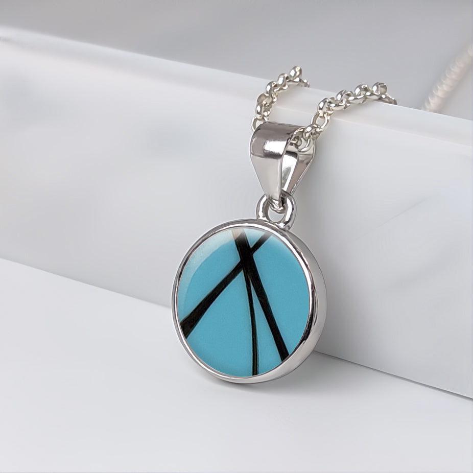 Colgante con pelo · Circulo de plata con pelo