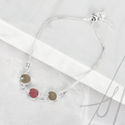 Pulsera de plata con cenizas en un triple círculo