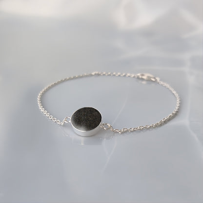 Pulsera con arena · Círculo de plata con arena o tierra